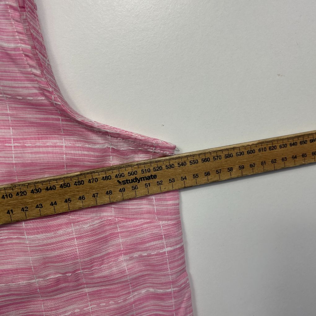 Pink striped fabric measured with ruler detail view