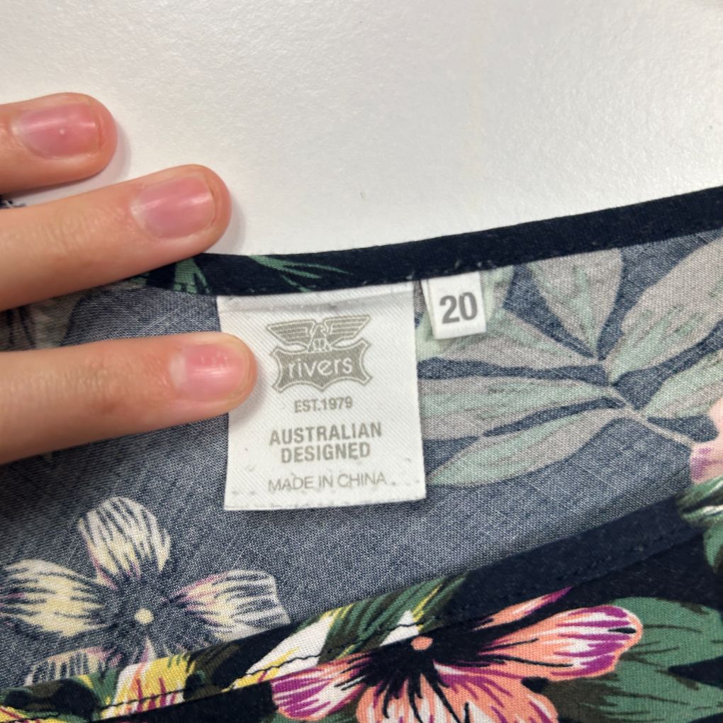 Navy floral dress label detail view