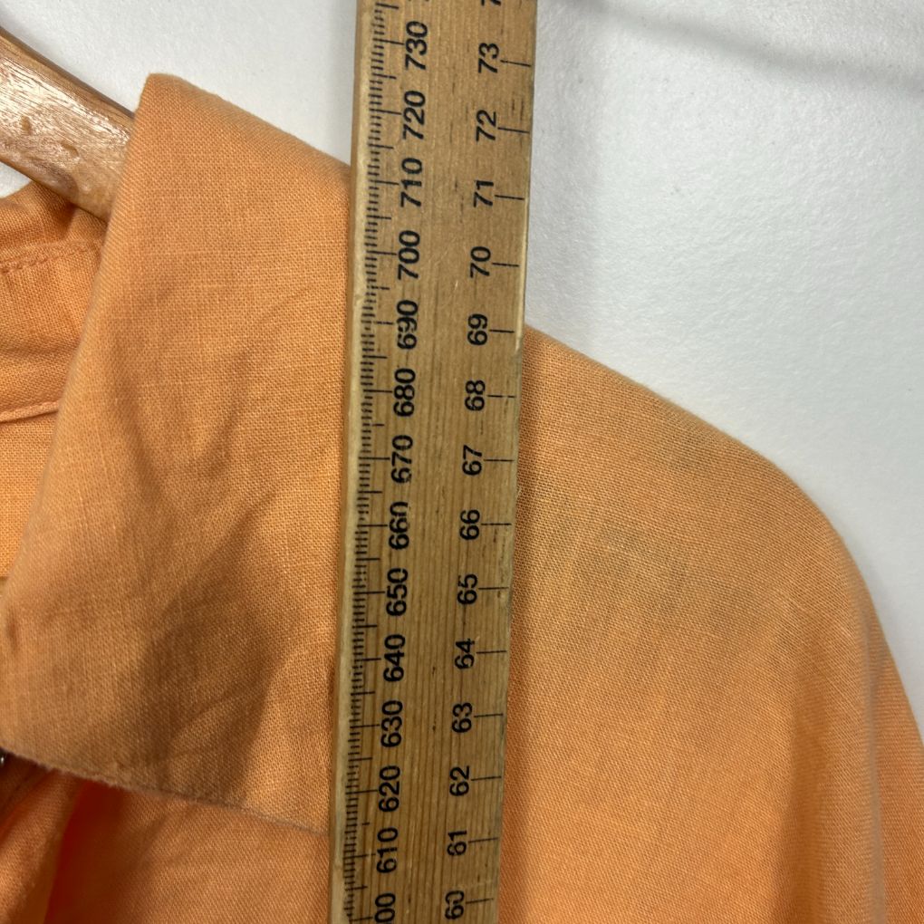 Orange shirt front view with measuring tape