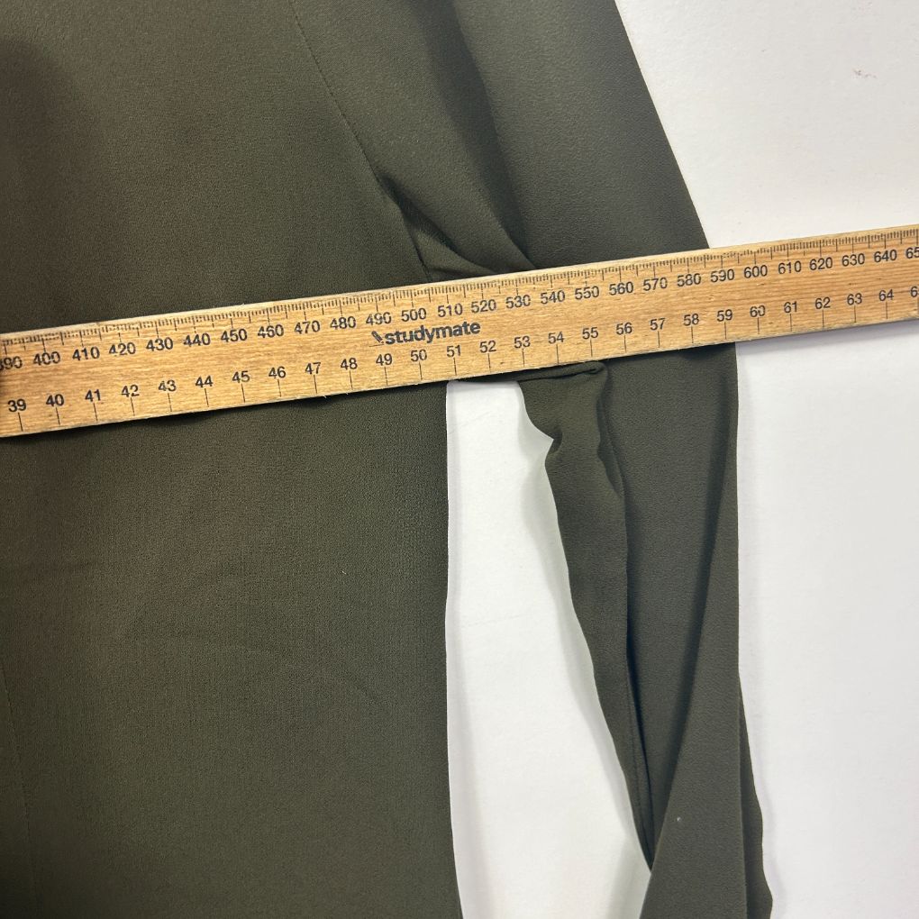 Olive green fabric with measuring tape detail view
