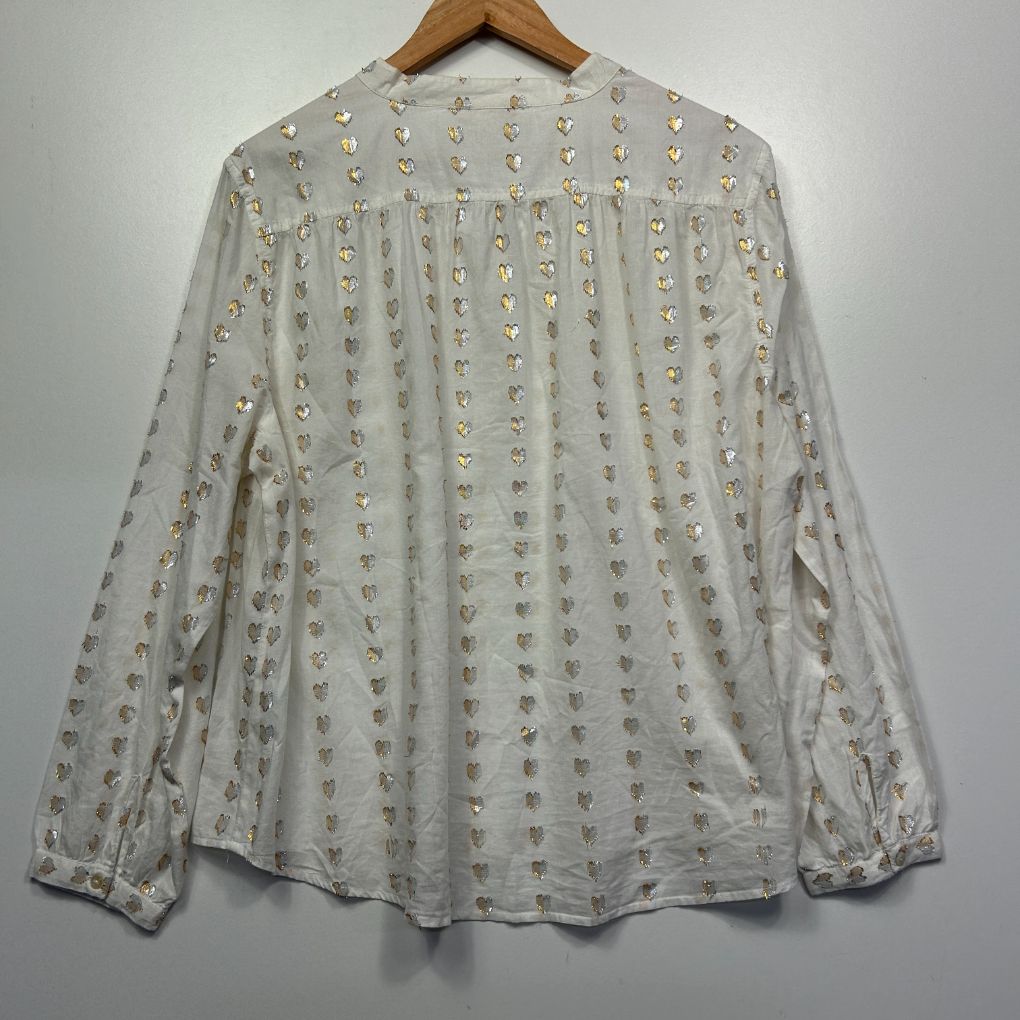Cream blouse back view with allover ditsy floral print