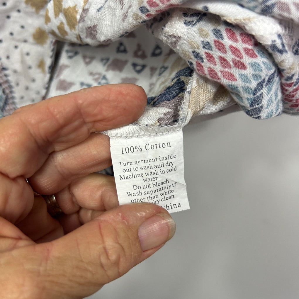 Cream cotton garment label detail view