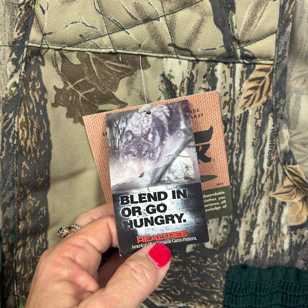 Camouflage jacket detail view with brand label