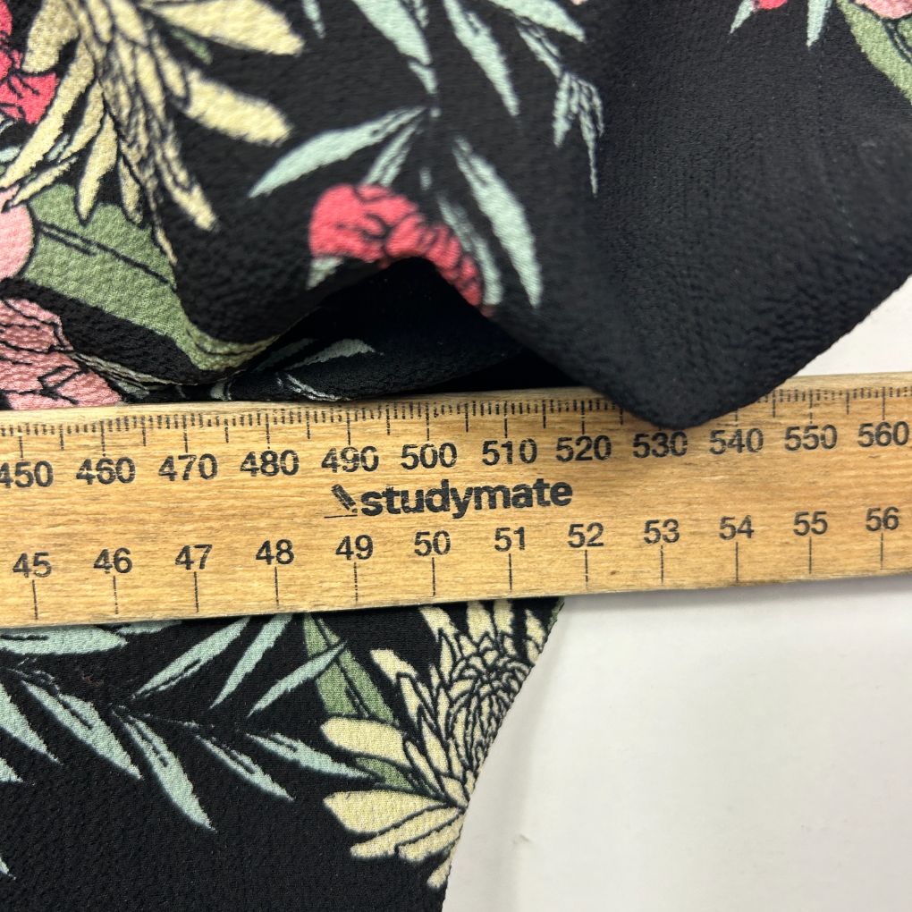 Black fabric with floral pattern detail view