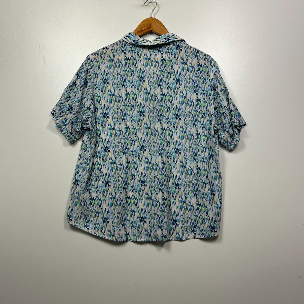 Blue patterned short sleeve shirt back view