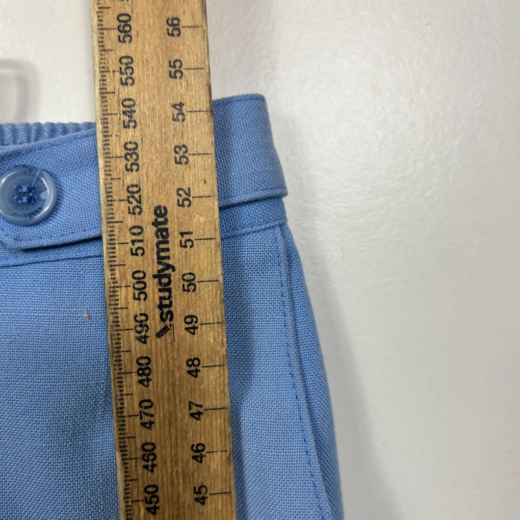 Blue shirt front view with measurement tape