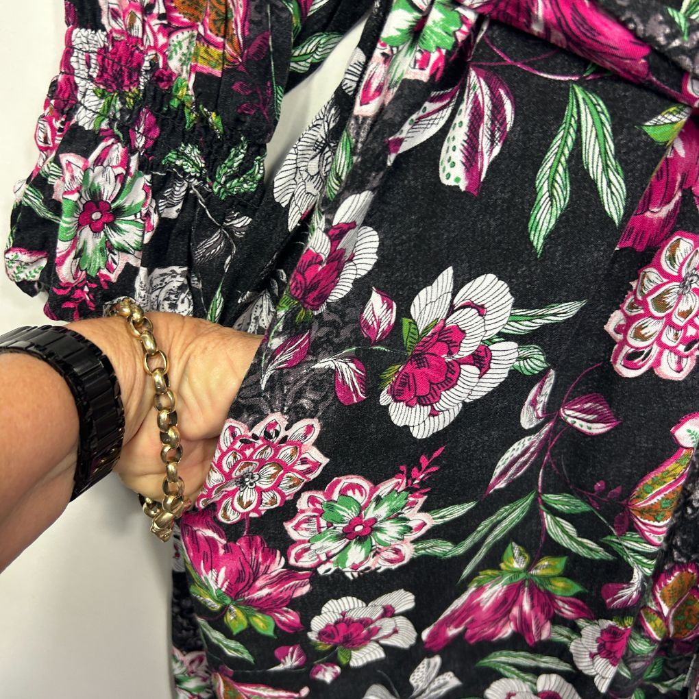 Black floral dress front view with pink and white flowers