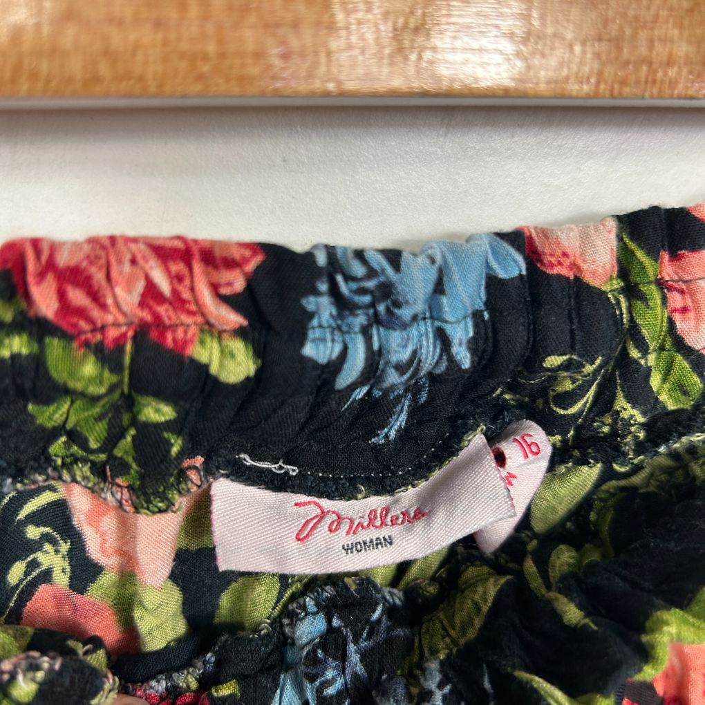 Floral dress detail view showing label