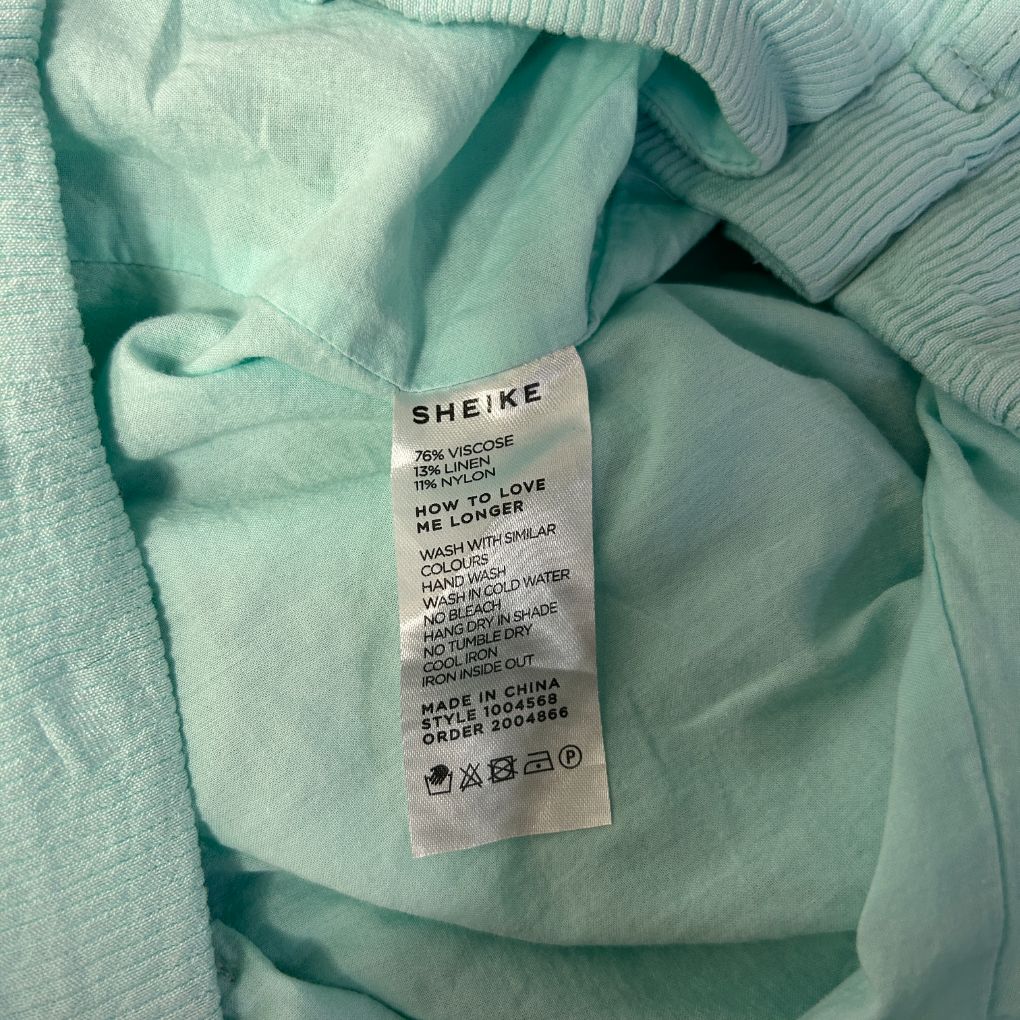 Mint green hoodie label detail view
