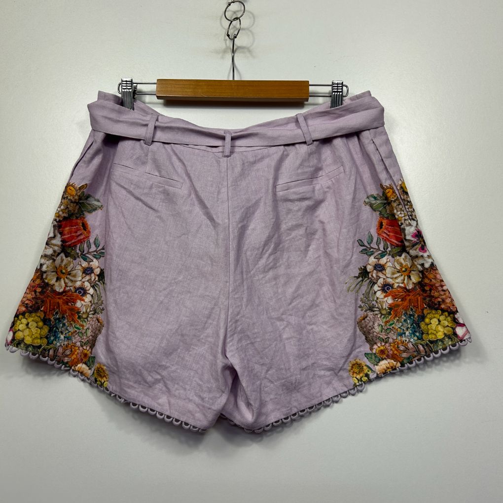 Lavender shorts with floral embroidered side panels front view