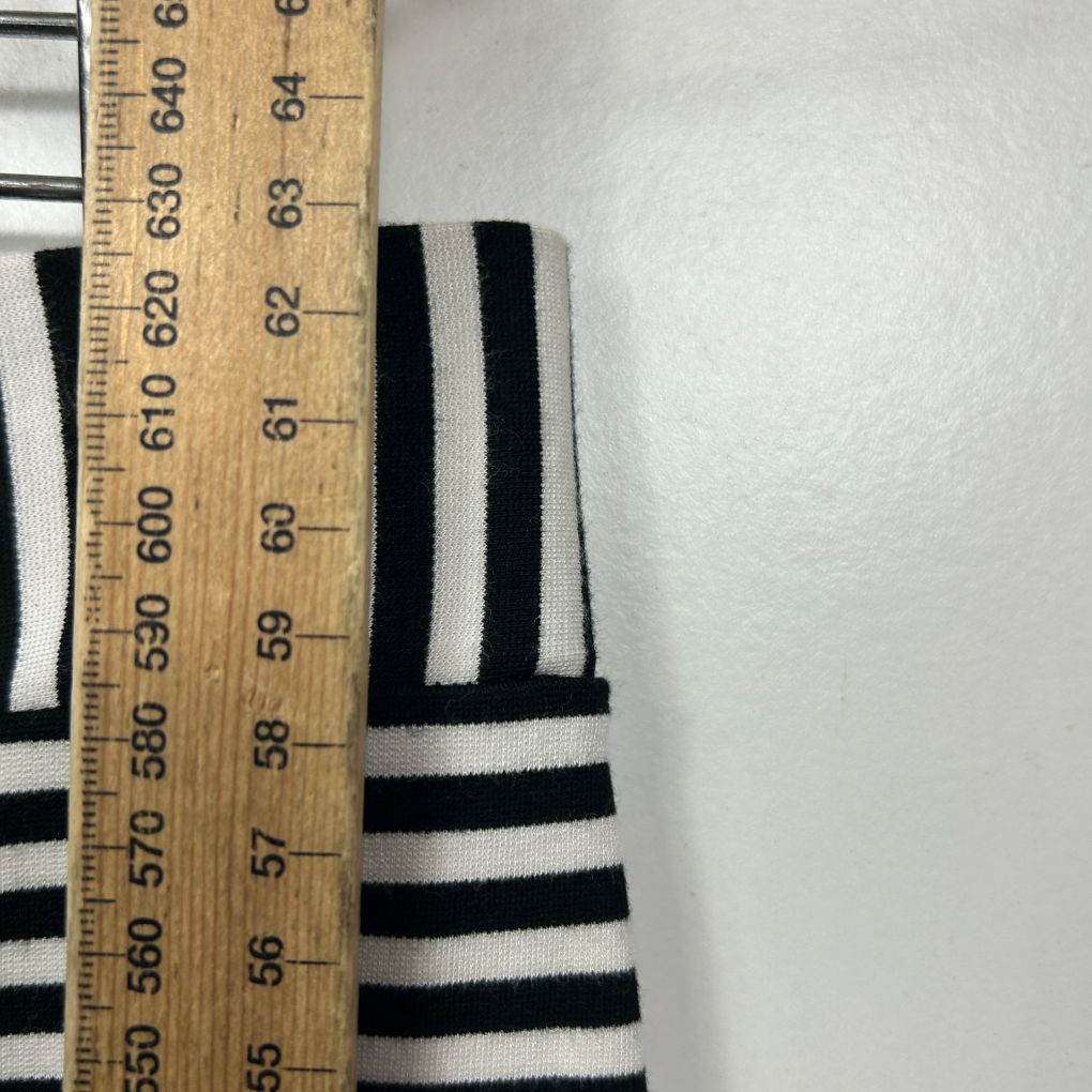 Black and white striped long sleeve top detail view