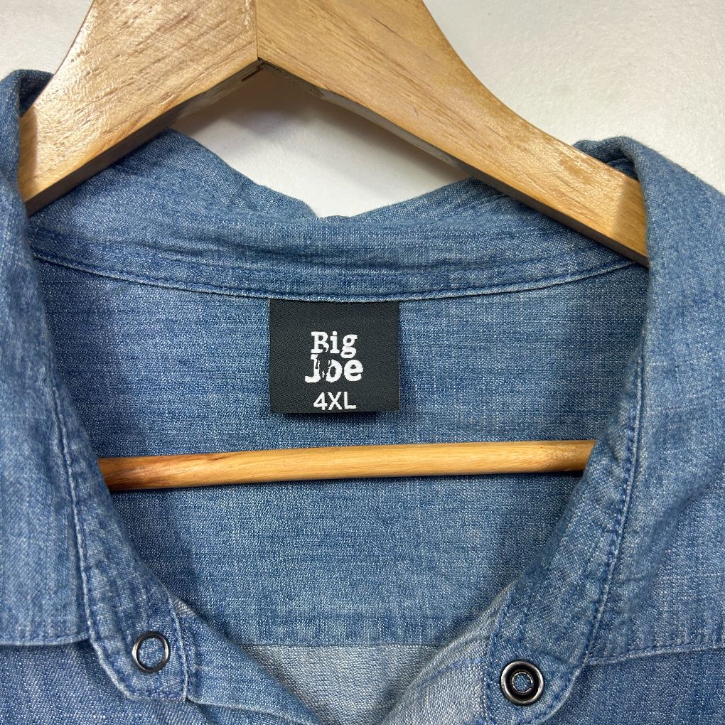 Blue denim shirt front view on wooden hanger