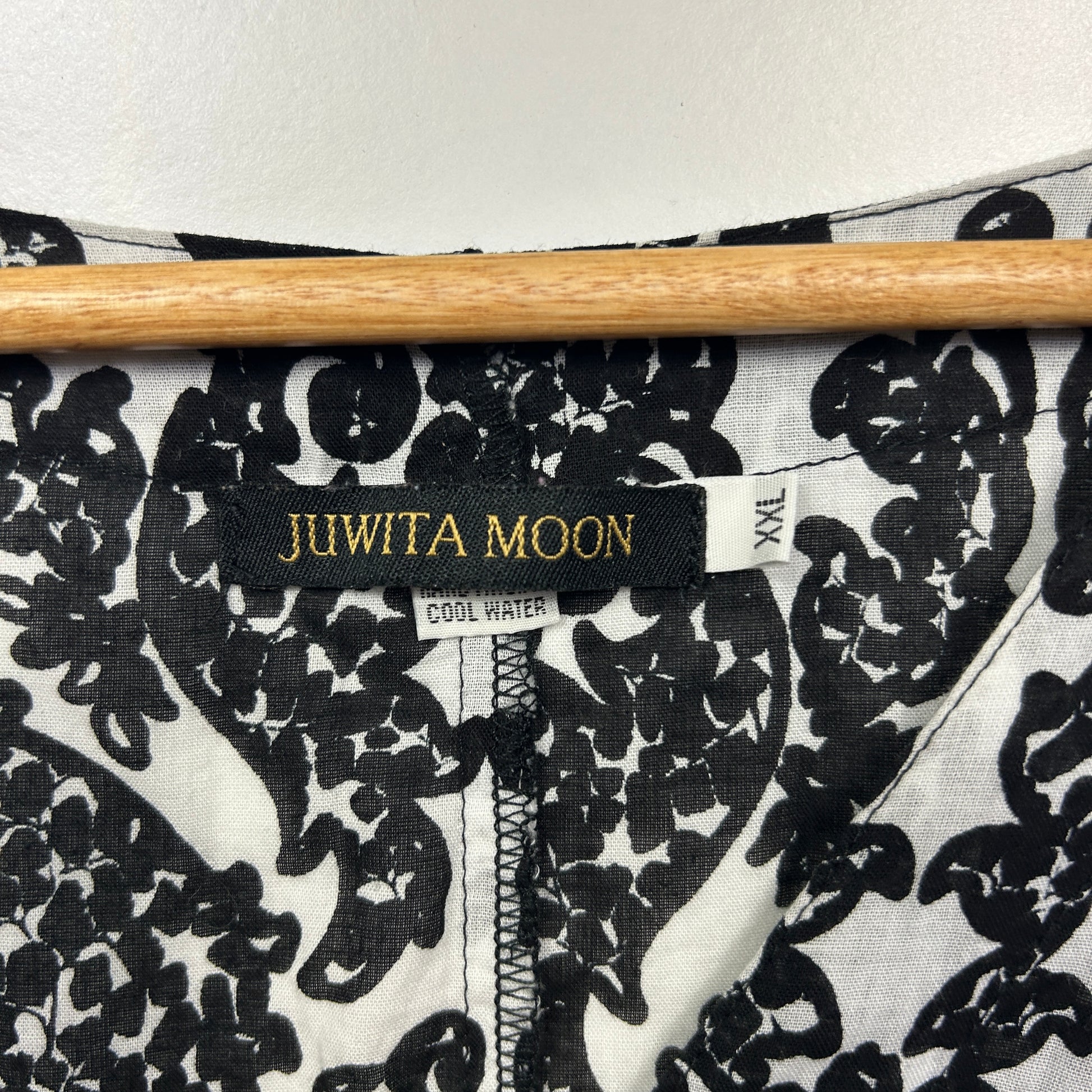 Black and white floral print top detail view